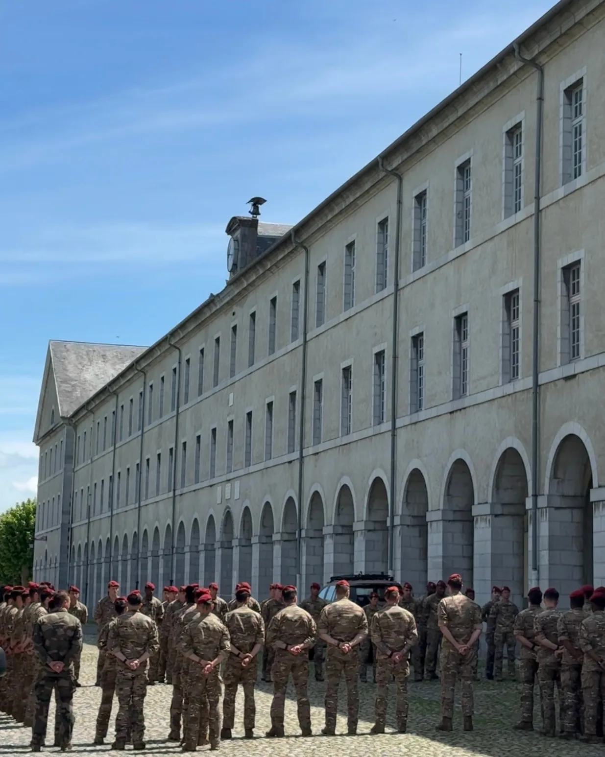 Army personnel gathered outside the facility