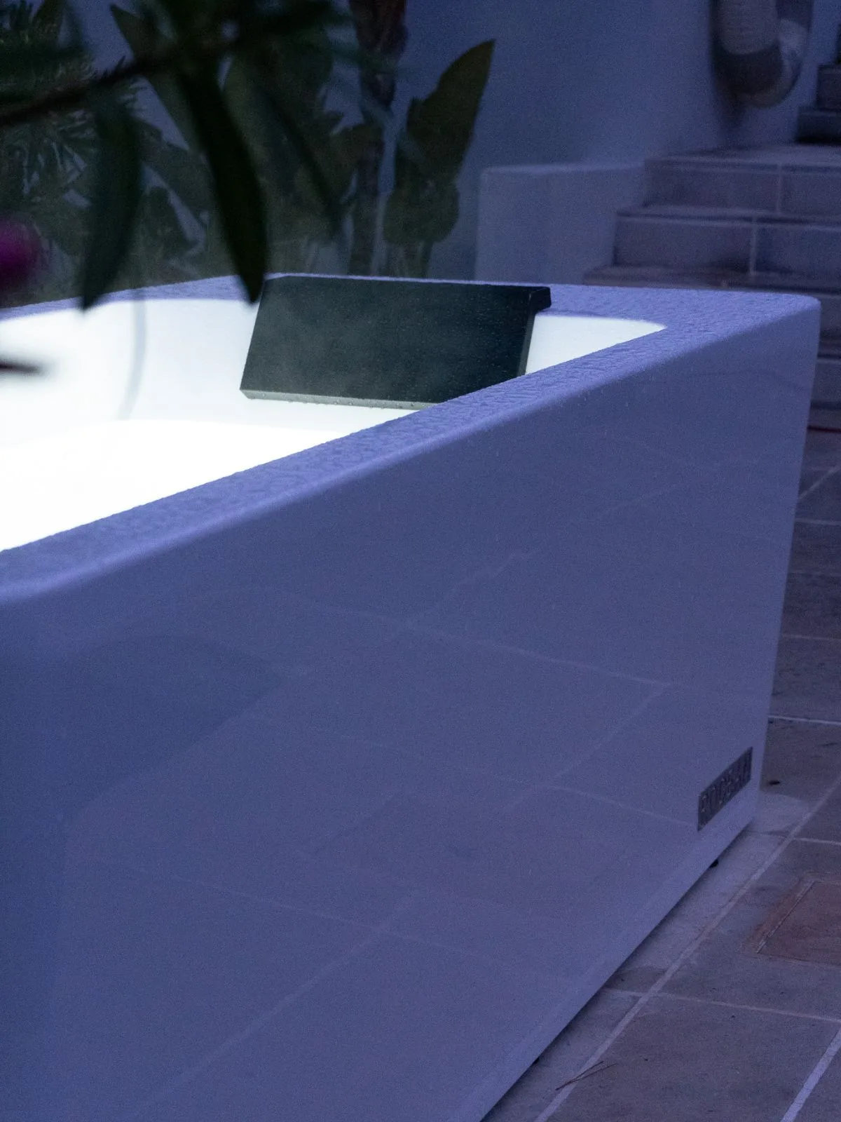 Rocean Bath illuminated at night